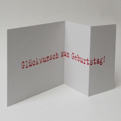 graue quadratische Geburtstagskarte: Glückstag!  (roter Druck)