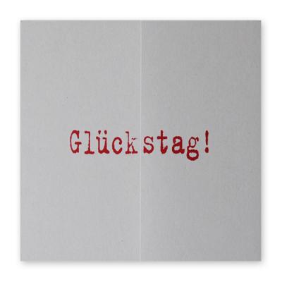 graue quadratische Geburtstagskarte: Glückstag!  (roter Druck)