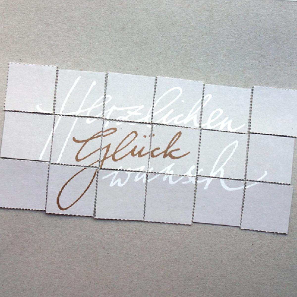 Herzlichen Glückwunsch, Glückwunschkarte zum Puzzeln mit goldenem Umschlag