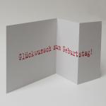 graue quadratische Geburtstagskarte: Glückstag!  (roter Druck)